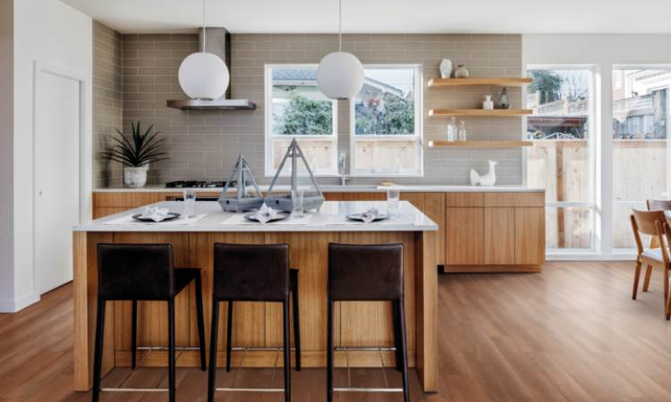 warm toned luxury vinyl flooring with wood cabinets and white countertops